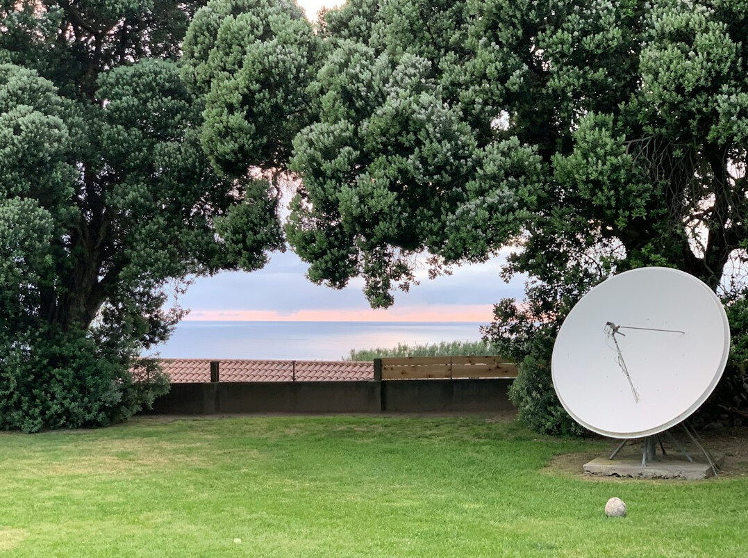Outside broadcast van with satellite uplink dish extended