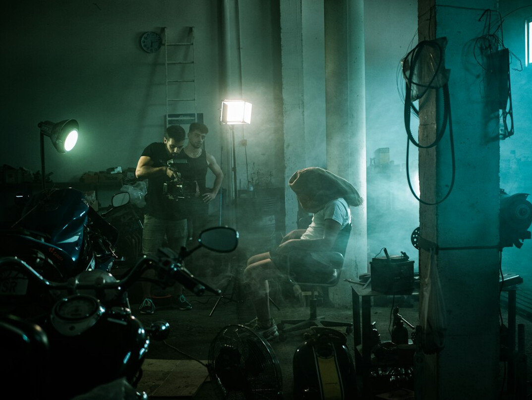 Camera operator filming a live television broadcast in a studio